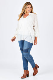 Model Fiona wearing size 16 of the Wild One Stitched Jeggings in colour Denim (Blue), from the front, showing the whole outfit