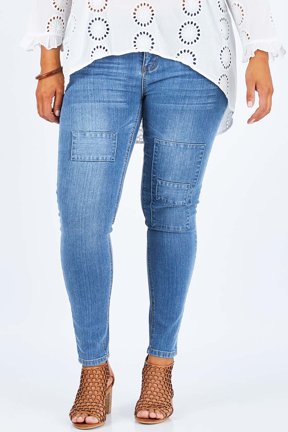 Model Palatina wearing size 14 of the You Patched Me All Up Jeans in colour PaleDenim (Blue), from the front, cropped image