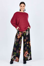 Model Georgia wearing size 10 of the Falling Leaves Wide Leg Pant in colour Black (Black), from the front, showing the whole outfit
