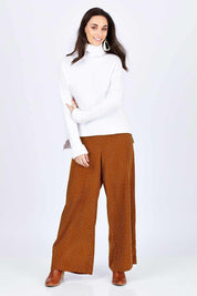 Model Georgia wearing size 10 of the Spotty About You Wide Leg Pants in colour Rust, from the front, showing the whole outfit