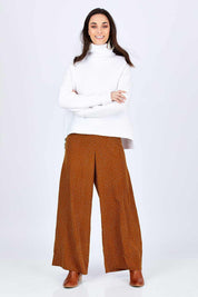 Model Georgia wearing size 10 of the Spotty About You Wide Leg Pants in colour Rust, from the front, showing the whole outfit