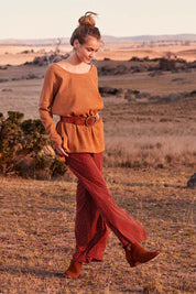 Model Marnee wearing size 10 of the Spotty About You Wide Leg Pants in colour Rust, from the front, showing the whole outfit