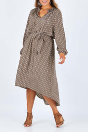 Model Palatina wearing size 14 of the Going With The Flow Dress in colour Taupe, from the front, cropped image