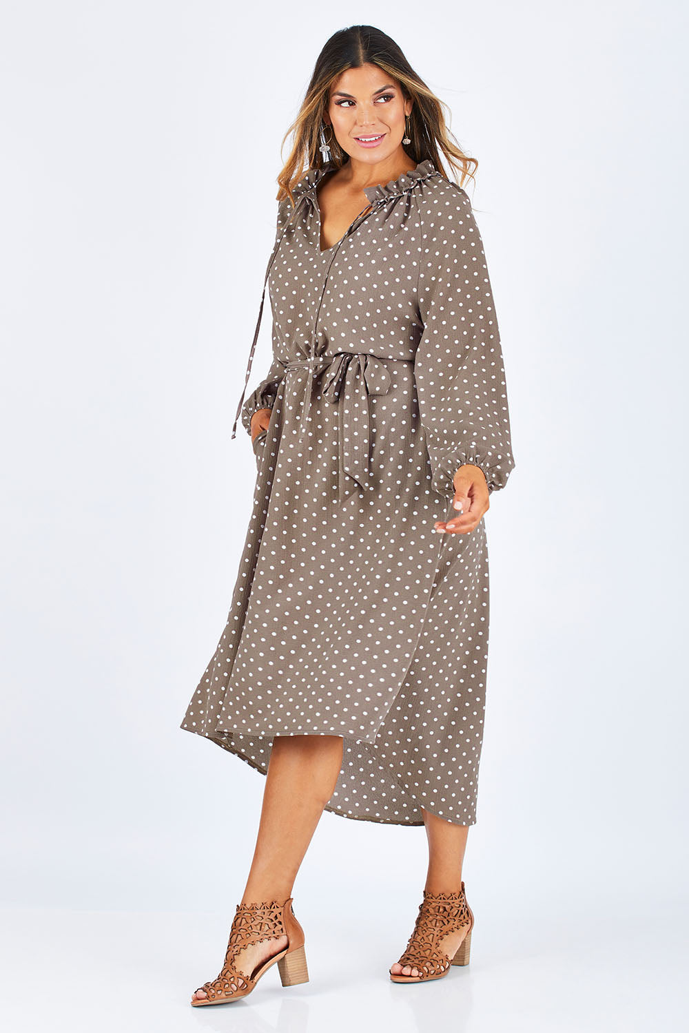 Model Palatina wearing size 14 of the Going With The Flow Dress in colour Taupe, from the front, showing the whole outfit