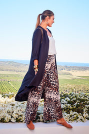 Model Palatina wearing size 14 of the You At My Shoulder Tunic in colour Black (Black), from the front, showing the whole outfit