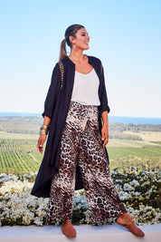 Model Palatina wearing size 14 of the You At My Shoulder Tunic in colour Black (Black), from the front, showing the whole outfit
