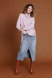 Model Emma wearing size 10 of the Happy Me Denim Skirt in colour Denim (Blue), from the front, showing the whole outfit