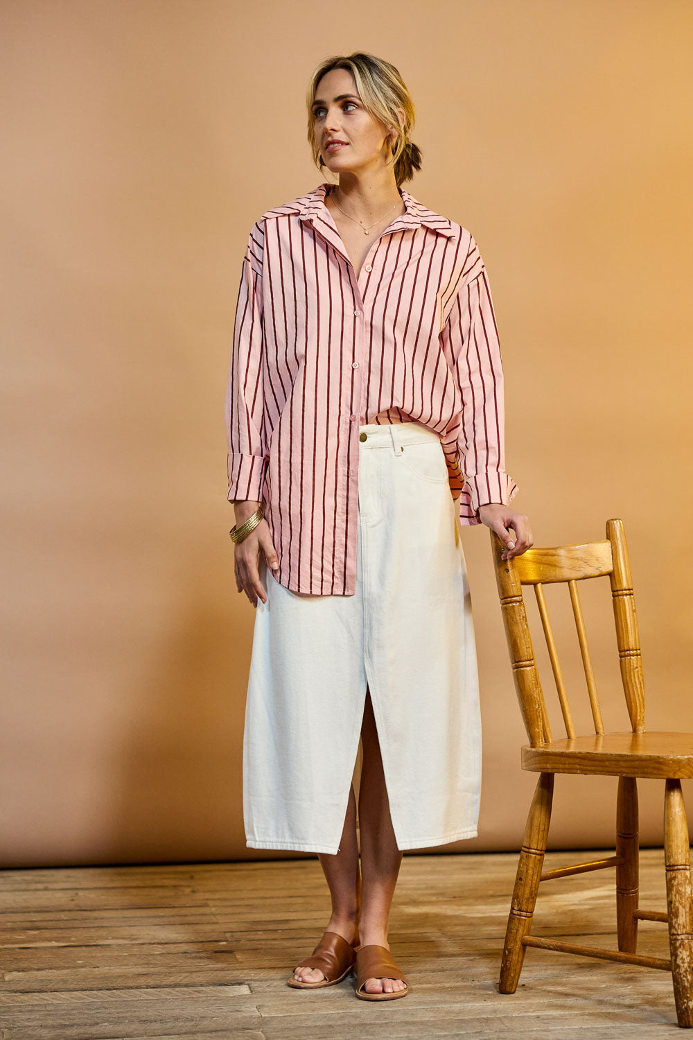 Model Tegan wearing size 10 of the Happy Me Denim Skirt in colour White (White), from the front, showing the whole outfit