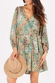 Model Gemma wearing size 10 of the Flower Safari Jumpsuit in colour Khaki (Green), from the front, cropped image