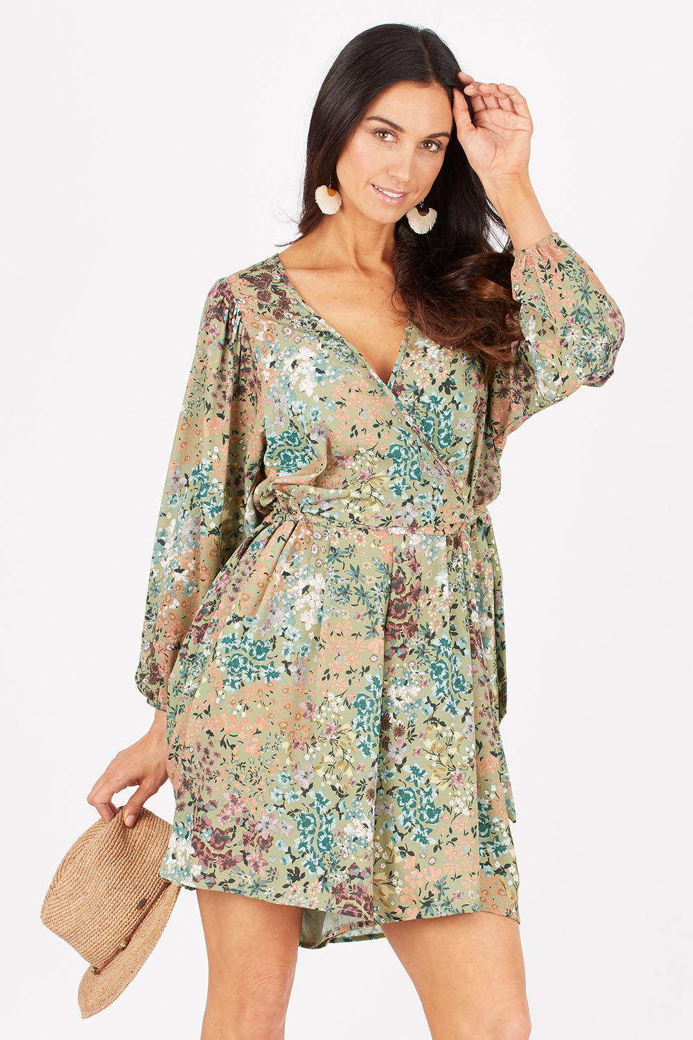 Model Gemma wearing size 10 of the Flower Safari Jumpsuit in colour Khaki (Green), from the front, cropped image