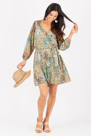 Model Gemma wearing size 10 of the Flower Safari Jumpsuit in colour Khaki (Green), from the front, showing the whole outfit