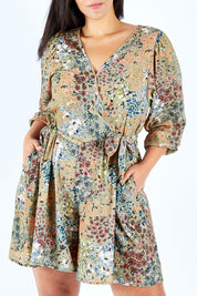 Model Lauren wearing size 18 of the Flower Safari Jumpsuit in colour Khaki (Green), from the front, cropped image