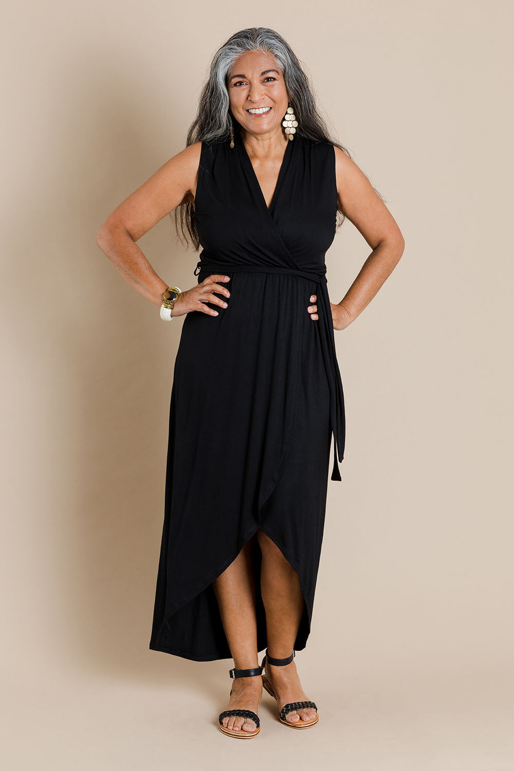 Model Nadine wearing size 10 of the Bamboo Freedom Faux Wrap Dress in colour Black (Black), from the front, showing the whole outfit