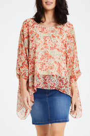 Model Andrea wearing size 10 of the Easy Peasy Throw Top in colour Orangepop, from the front, cropped image
