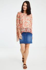 Model Andrea wearing size 10 of the Easy Peasy Throw Top in colour Orangepop, from the front, showing the whole outfit