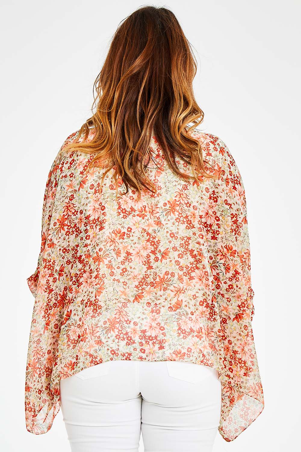 Model Laura wearing size 14 of the Easy Peasy Throw Top in colour Orangepop, from the back