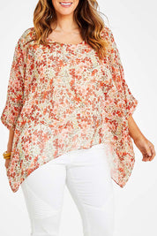Model Laura wearing size 14 of the Easy Peasy Throw Top in colour Orangepop, from the front, cropped image