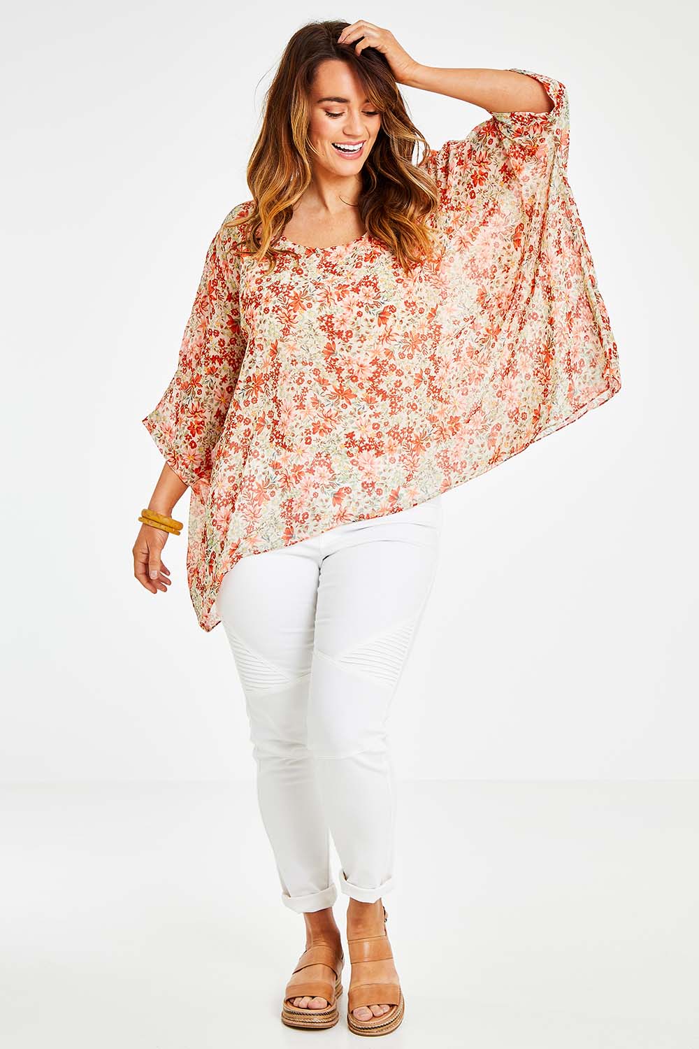 Model Laura wearing size 14 of the Easy Peasy Throw Top in colour Orangepop, from the front, showing the whole outfit