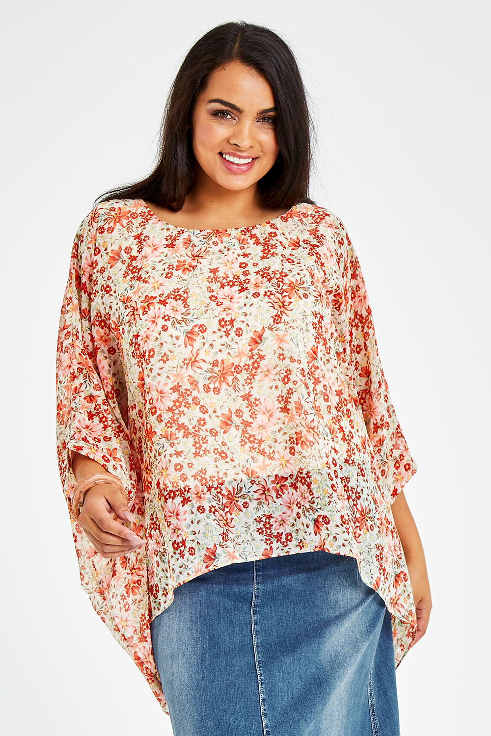 Model Sasha-Lee wearing size 16 of the Easy Peasy Throw Top in colour Orangepop, from the front, cropped image