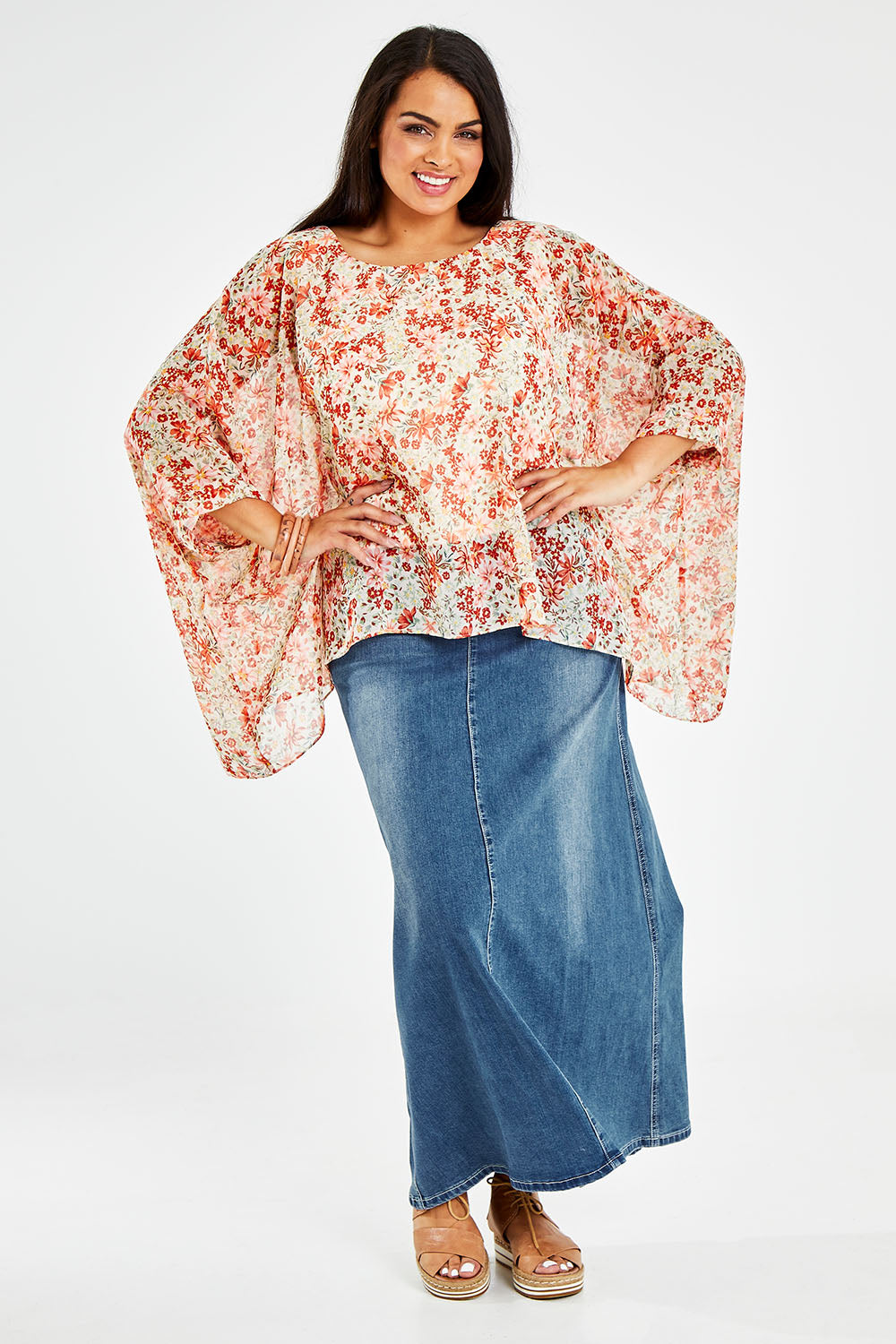 Model Sasha-Lee wearing size 16 of the Easy Peasy Throw Top in colour Orangepop, from the front, showing the whole outfit