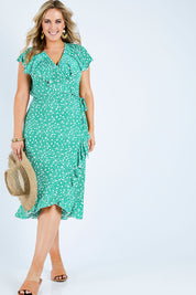 Model Jess wearing size 14 of the Life Is Beautiful Wrap Dress in colour Greenspot (Green), from the front, showing the whole outfit