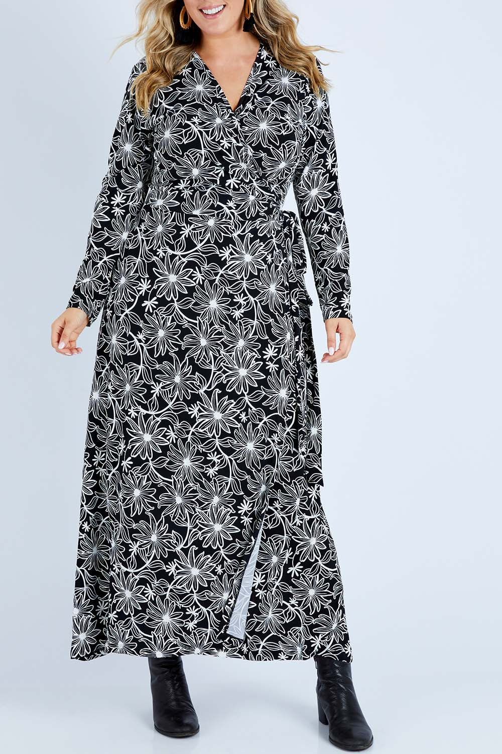 Model Jess wearing size 14 of the Flowers In Winter Wrap Maxi Dress in colour Blkwhite (Black), from the front, cropped image