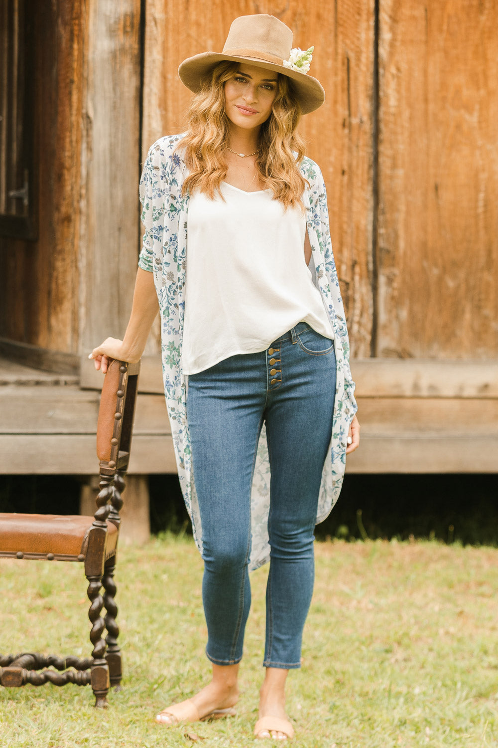 Model Ilona wearing size 10 of the Follow Me Home Button Jeggings in colour Denim (Black), from the front, showing the whole outfit