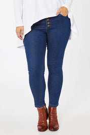 Model Jess wearing size 14 of the Follow Me Home Button Jeggings in colour Denim (Black), from the front, cropped image