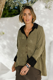 Model Tegan wearing size 10 of the My Boyfriends Slouch Cardi in colour Olive (Green), from the front, showing the whole outfit