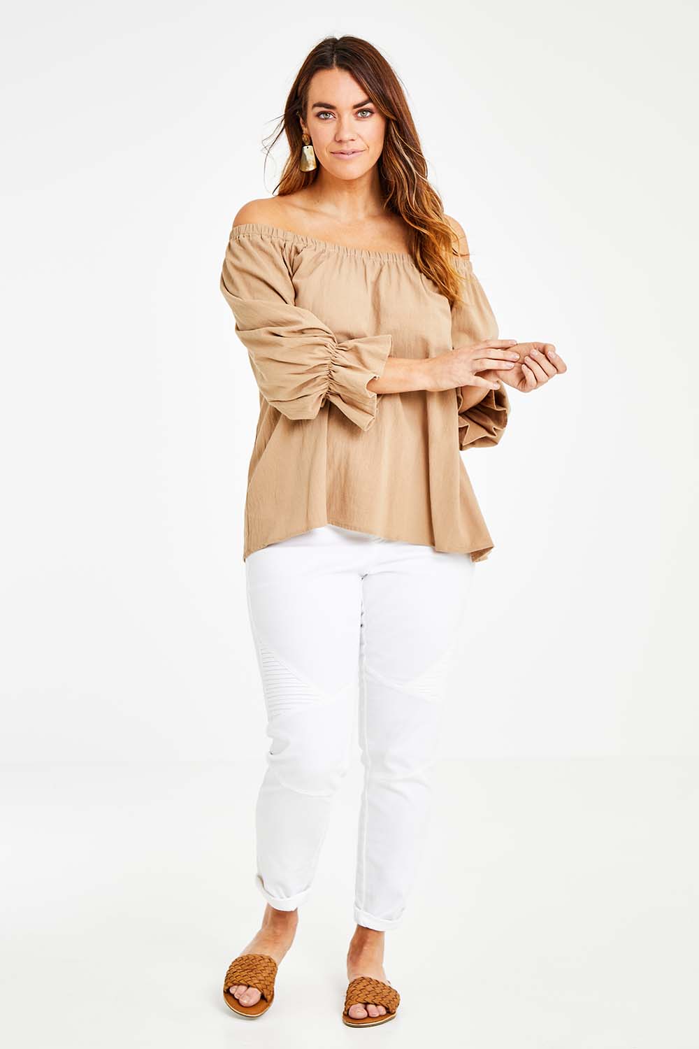 Model Laura wearing size 14 of the Twinkle In My Eye Off The Shoulder Top in colour Sand, from the front, showing the whole outfit