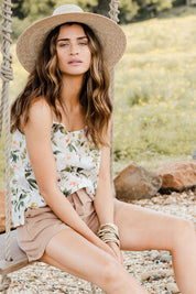 Model Ilona wearing size 10 of the Down The Garden Path Linen Tank in colour Garden (White), from the front, showing the whole outfit