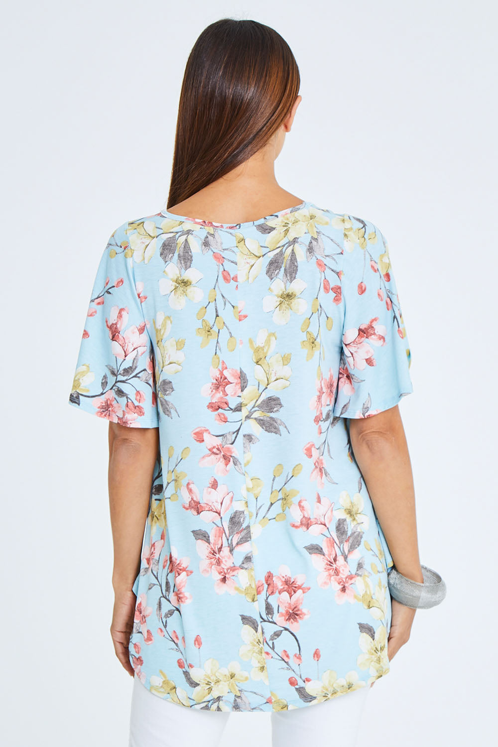 Model Cara wearing size 10 of the Free Falling Top in colour Blossom (Blue), from the back