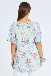 Model Cara wearing size 10 of the Free Falling Top in colour Blossom (Blue), from the back