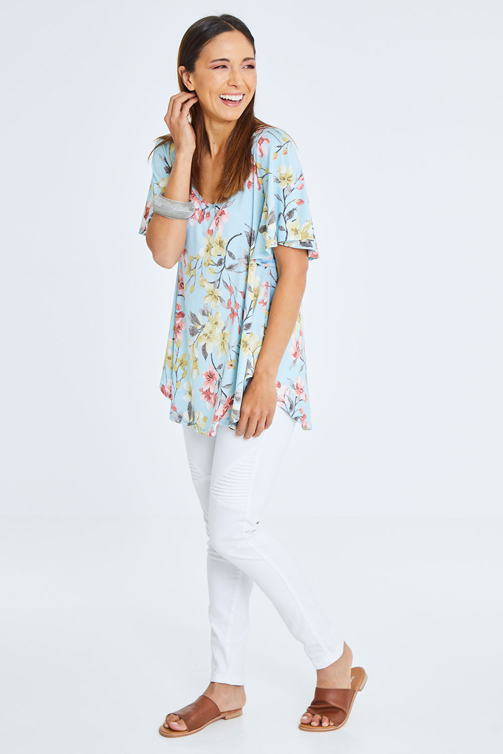 Model Cara wearing size 10 of the Free Falling Top in colour Blossom (Blue), from the front, showing the whole outfit
