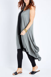 Model Laura wearing size 12 of the Softly Swinging Bamboo Vest in colour Fern (Green), from the front, cropped image