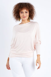 Model Lala wearing size 10 of the Softly Swinging Bamboo Batwing Top in colour Ballet (Pink), from the front, cropped image