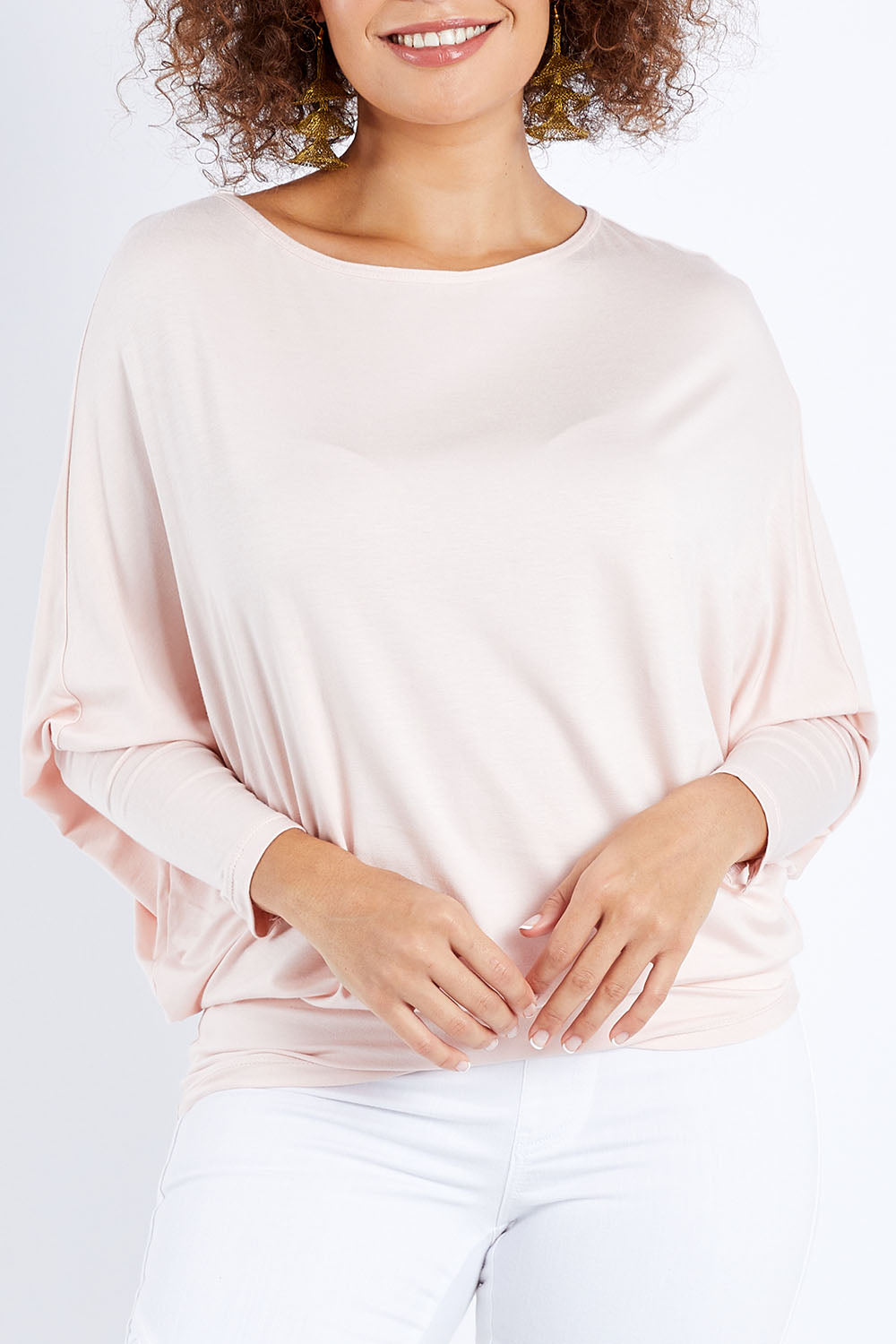 Model Lala wearing size 10 of the Softly Swinging Bamboo Batwing Top in colour Ballet (Pink), from the front, cropped image