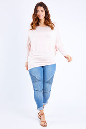 Model Laura wearing size 14 of the Softly Swinging Bamboo Batwing Top in colour Ballet (Pink), from the front, showing the whole outfit