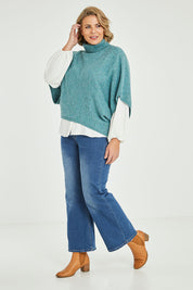 Model Fiona wearing size XL of the Addicted To You Sweater in colour Sea (Blue), from the front, showing the whole outfit
