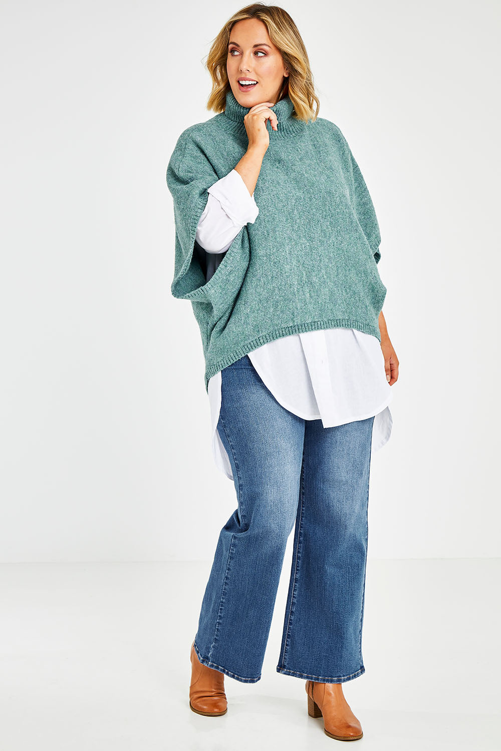 Model Jess wearing size L of the Addicted To You Sweater in colour Sea (Blue), from the front, showing the whole outfit