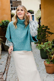 Model Tegan wearing size S of the Addicted To You Sweater in colour Sea (Blue), from the front, showing the whole outfit