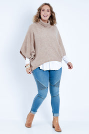 Model Jess wearing size L of the Addicted To You Sweater in colour Camel, from the front, showing the whole outfit