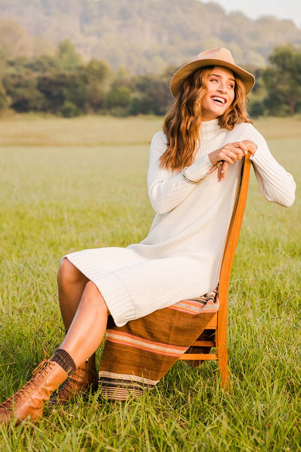 Model Ilona wearing size S of the With My Crew Sweater Dress in colour Snow (White), from the front, showing the whole outfit