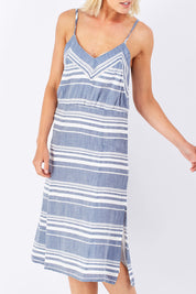 Model Jude wearing size 10 of the Orla Dress in colour Mohalo (Blue), from the front, cropped image