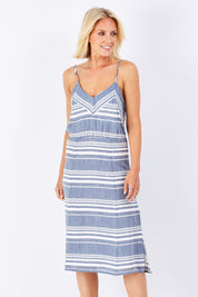 Model Jude wearing size 10 of the Orla Dress in colour Mohalo (Blue), from the front, cropped image