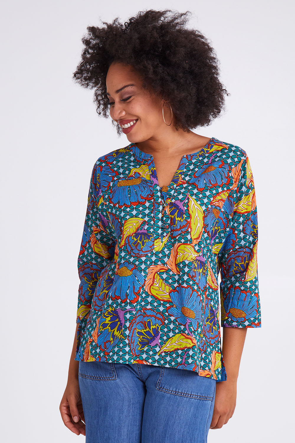 Model Olivia wearing size 10 of the Edith Top in colour Edith (Blue), from the front, cropped image