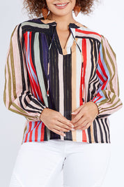 Model Lala wearing size 10 of the Fleetwood Top in colour Manhattan, from the front, cropped image