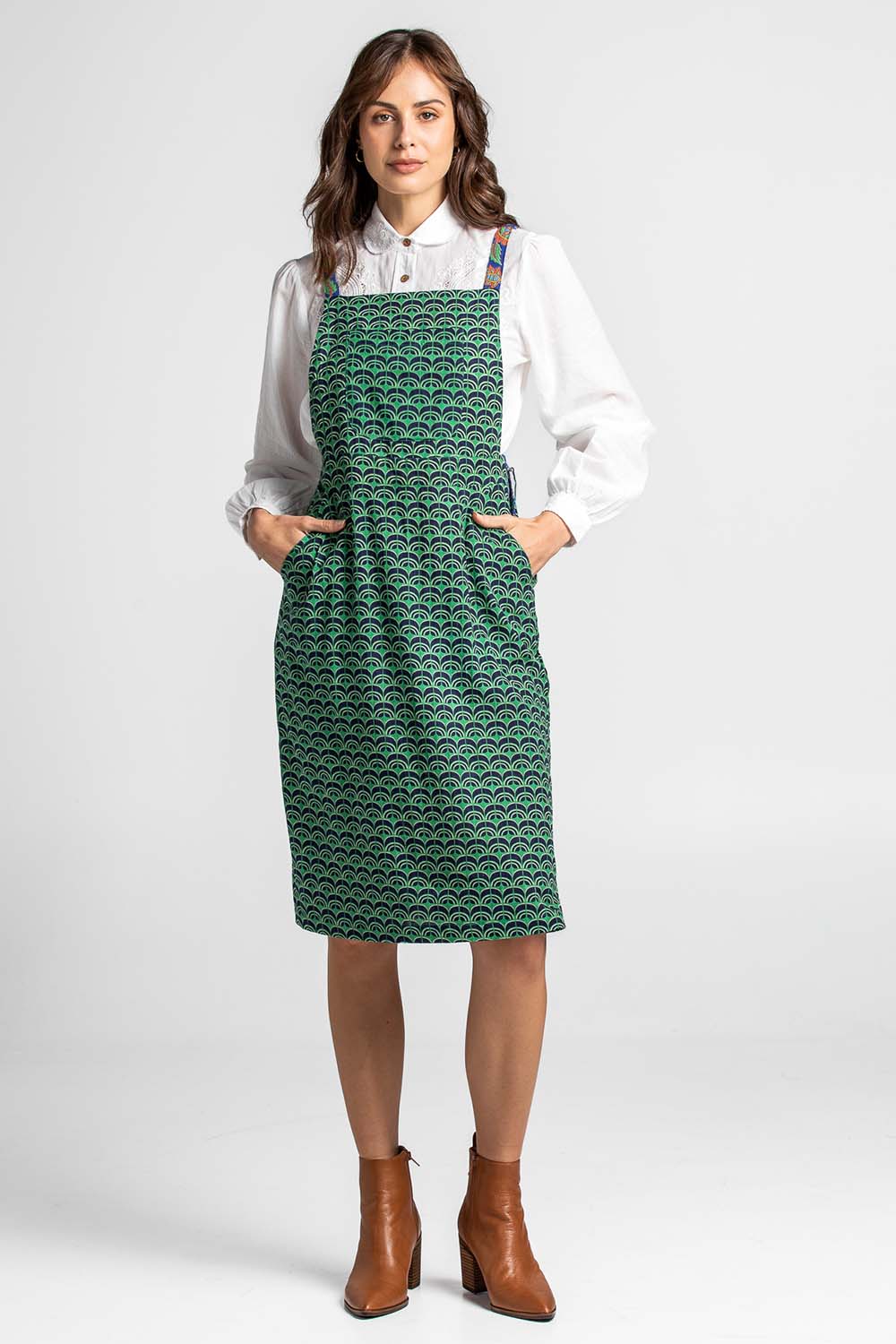 A model wearing the Berty Reversible Tunic in colour Fresconavy (Blue), from the front, showing the whole outfit