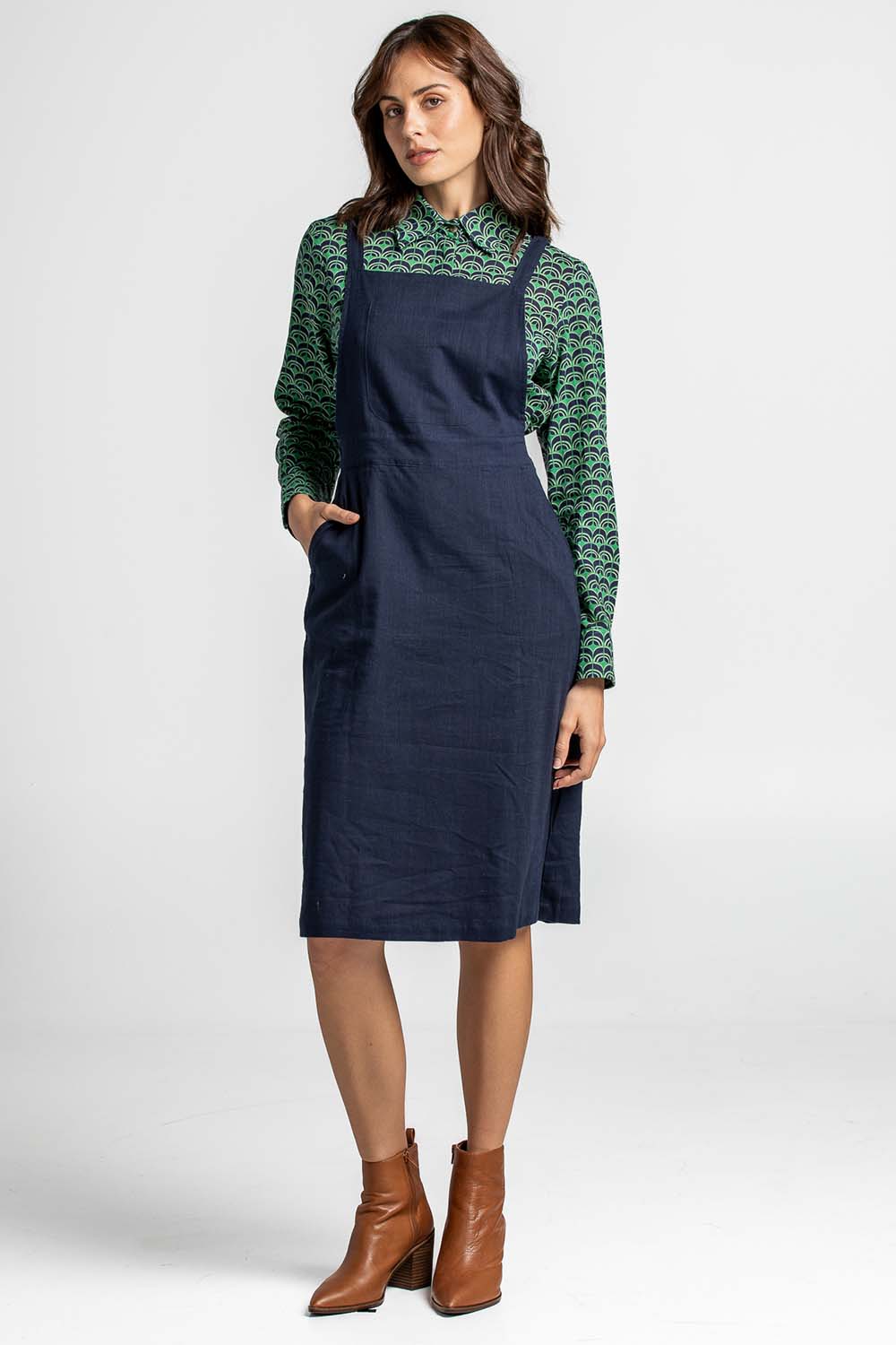 A model wearing the Berty Reversible Tunic in colour Fresconavy (Blue), from the front, showing the whole outfit