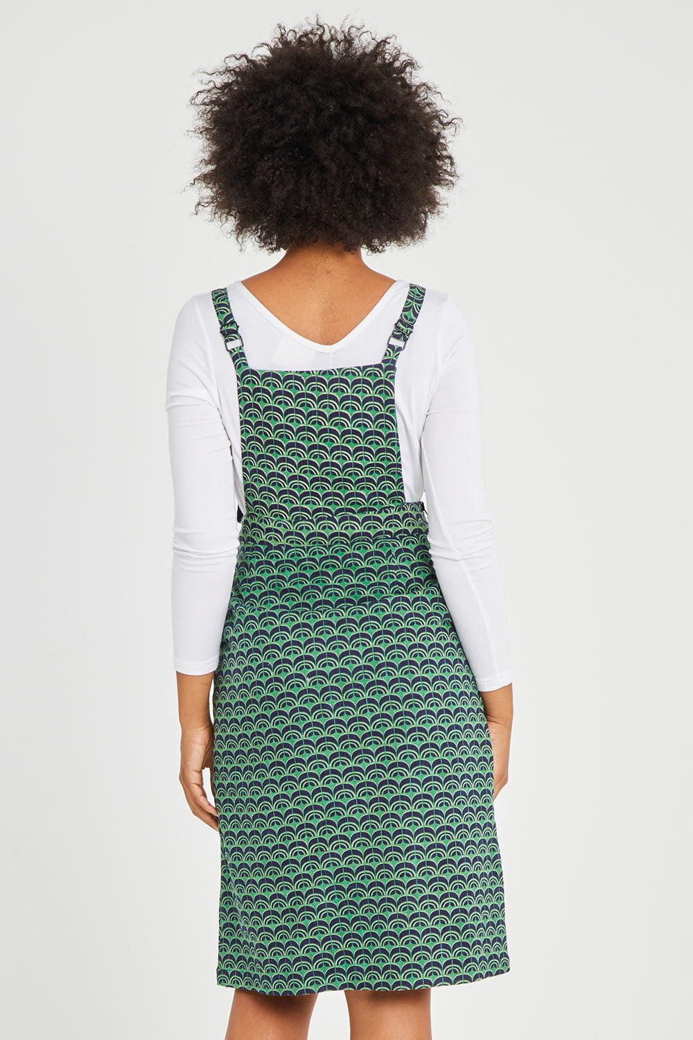Model Olivia wearing size 10 of the Berty Reversible Tunic in colour Fresconavy (Blue), from the back